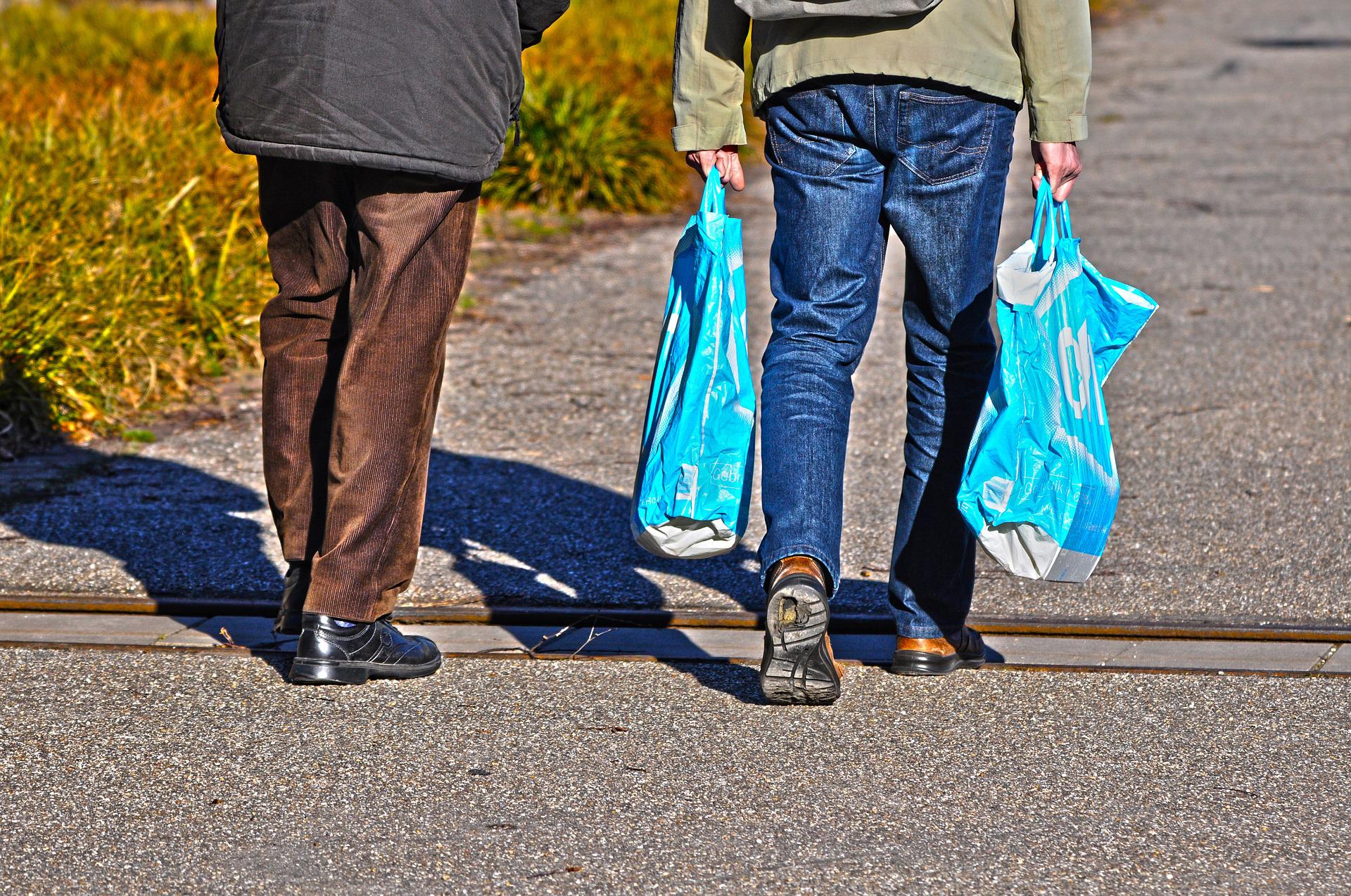 Couple carrying a food bag